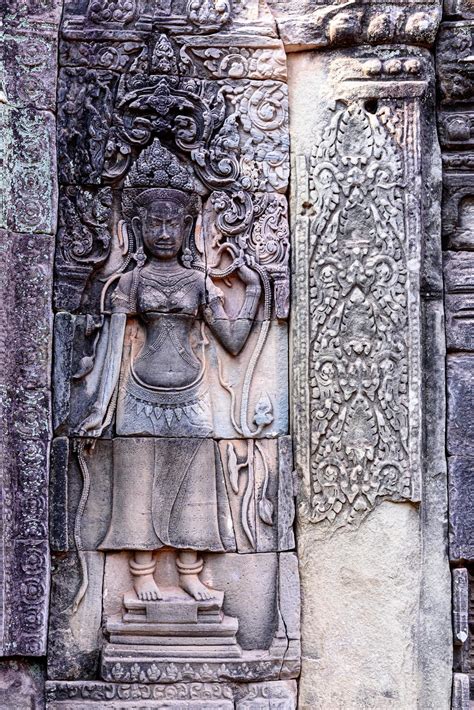 Stone Carvings On The Walls Of The Bayon Temple In Angkor Thom 3078719