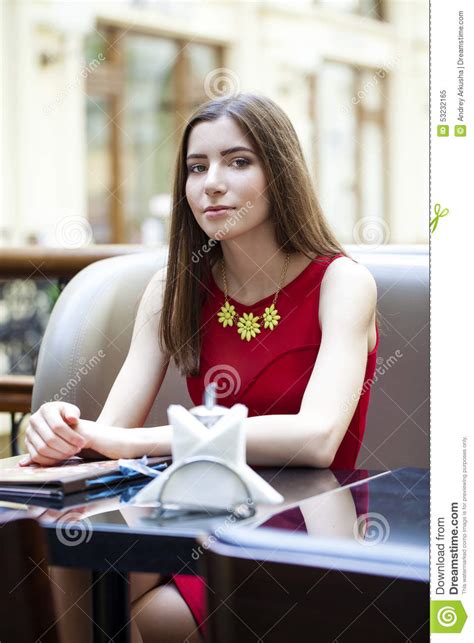 beautiful brunette girl sitting in a coffee shop stock image image of girl beauty 53232165