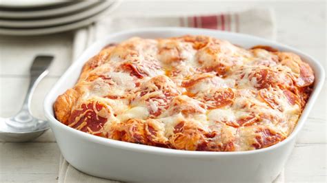 Instead of a homemade pizza crust, you can use two cans of pillsbury refrigerated crust to save time. Grands!® Pepperoni Pizza Bake recipe from Pillsbury.com