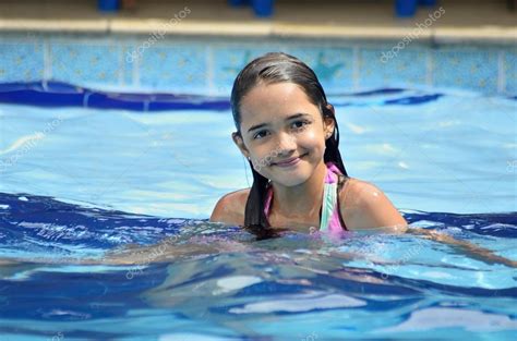 Hispanic Little Girl In Swimming Pool — Stock Photo © Aaraujo 64996977