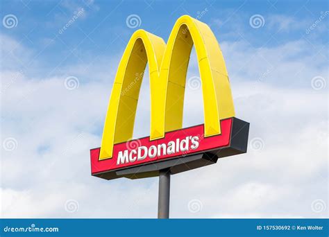 Mcdonald`s Golden Arches Signage Outside The Fast Food Restaurant