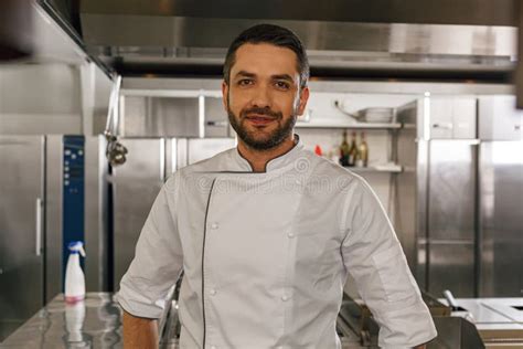Portrait Of Handsome Male Chef In Uniform Standing On Kitchen Of Restaurant Stock Image Image