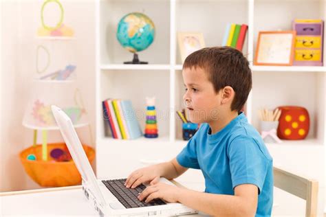 Boy Playing Or Working On Laptop Computer Stock Images Image 18913074