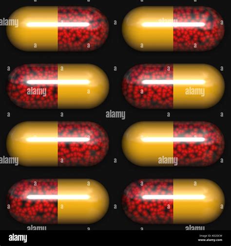 Red And Yellow Capsules On Black Background Stock Photo Alamy