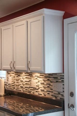 Crown molding can give even stock cabinetry an upscale feel. Kitchen Cabinets With Crown Molding