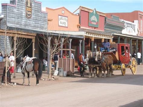 Photo about rugged old wild west town in central arizona, usa, as seen from the entrance of the corner saloon. Tombstone: A Town Too Tough to Die with a History too Cool ...