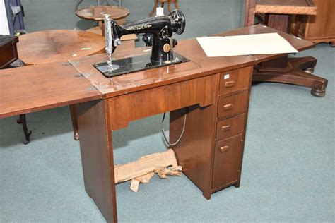 The old singer cabinets have 2 hinges with pins on them. 1960's walnut single pedestal sewing machine cabinet with ...