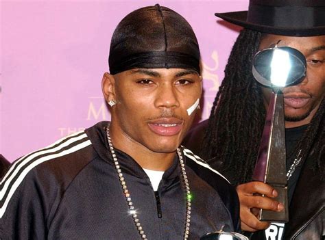 Til That Rapper Nelly Wore A Bandaid Over His Left Cheek To Initially Cover A Basketball Injury