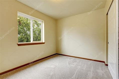 Use them in commercial designs under lifetime, perpetual & worldwide rights. Bright small empty room with carpet floor, window and ...