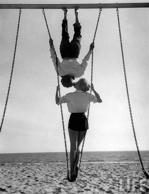 allan grant swingers acrobat and actor russ tamblyn on the beach with movie actress venetia