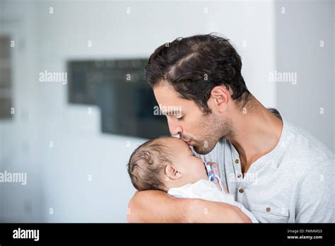 Close Up Of Father Kissing Baby Stock Photo Alamy