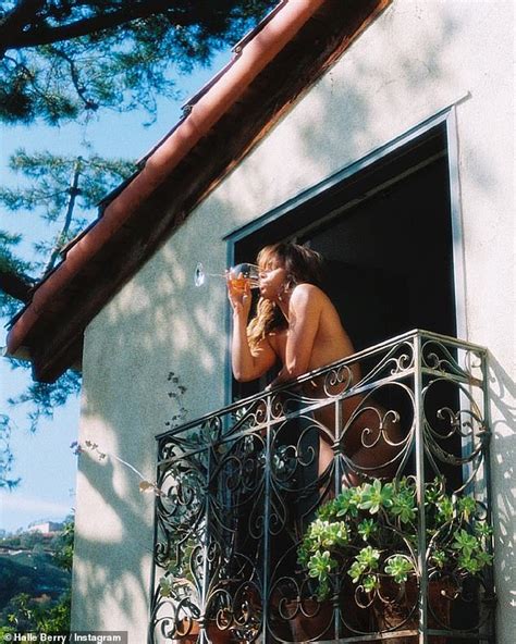 Halle Berry 56 Poses NUDE On A Balcony As She Sips From A Glass Of