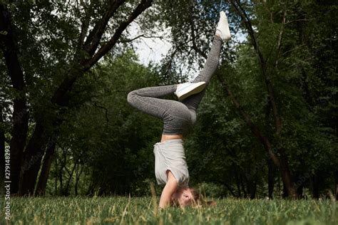 Beautiful Sporty Fit Yogi Woman Practices Yoga Handstand Asana Bhuja Vrischikasana Scorpion