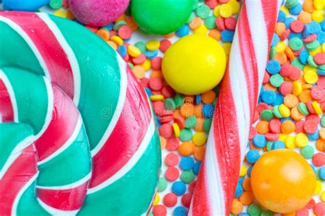 Background Of A Bunch Colorful Sweet Candies And Candy Canes Stock