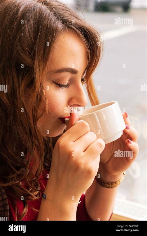 Beautiful Young Girl Drinking Coffee Stock Photo Alamy