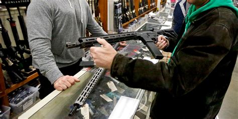 man sues walmart and dick s for refusing to sell him a gun business insider