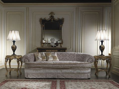 An Ornate Sofa And Two Lamps In A Room