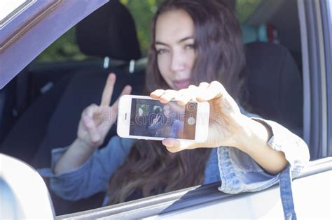 Girl Driver Take A Selfie While Driving His Car Blur Effect In The
