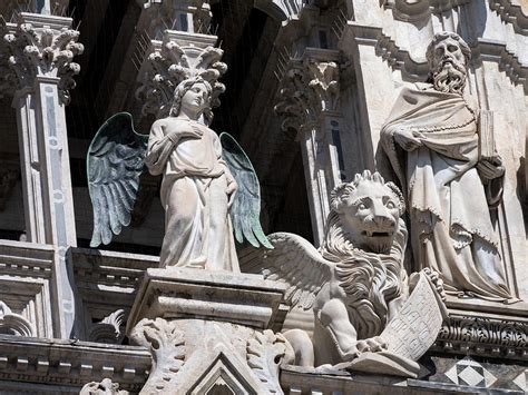 Statues Of Angel Lion And Philosopher At Siena Cathedral Photograph By