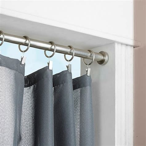 Do you have a large wall of windows and struggle to find an affordable curtain rod solution? Window Treatment with Tension Rod Curtain - HomesFeed