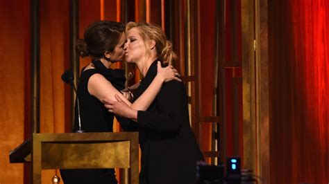 tina fey amy schumer kiss on stage at peabody awards entertainment tonight