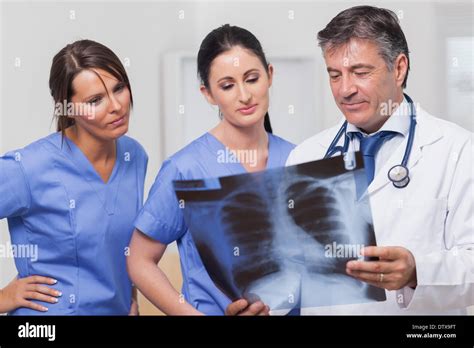 Doctor And Nurses Looking Xray Stock Photo Alamy