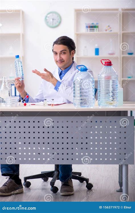 Young Male Chemist Experimenting In Lab Stock Photo Image Of Exam