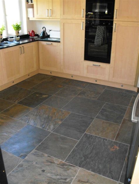 Because it's a natural material, natural stone kitchen floor tiles are some of the most expensive flooring options. Like the contrast of this tile with pine cabinets | Slate ...
