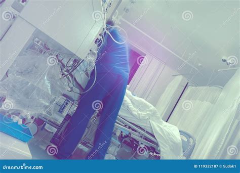 Male Doctor Working With Critical Patient In The Icu Stock Image