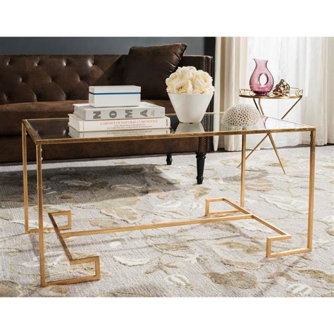 A modern end table will have a minimal design with geometric shapes in neutral color tones. Safavieh Burton Glass/Antique Gold Coffee Table-FOX2582A ...
