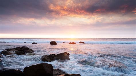 Download Wallpaper 3840x2160 Sunset Sea Waves Stones Landscape 4k