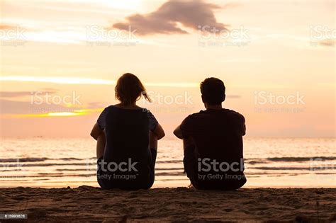 Friendship Friends Sitting Together On The Beach Stock Photo Download
