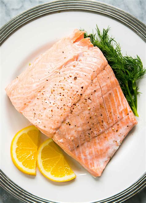 Pour in chicken broth and lemon juice. Poached Salmon