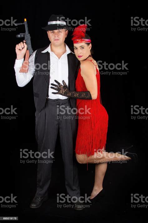 Dangerous Bonny And Clyde Gangster With 1920 Style Clothes Standing