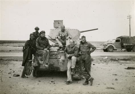 United States Servicemen Pose With An Italian Tank In North Africa