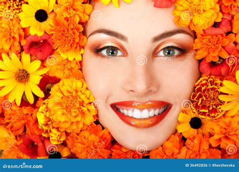 Beauty Portrait Of Beautiful Female Face With Orange Flowers Frame
