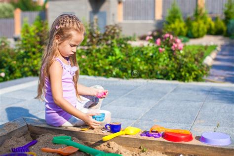 Little Cute Girl Playing At The Sandbox With Toys Stock Image Image