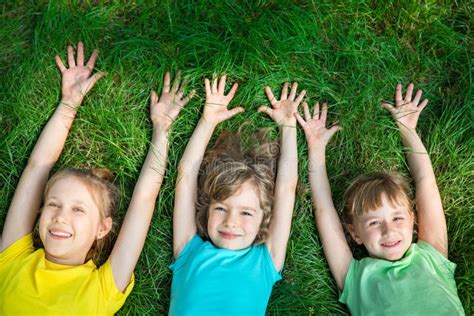 Group Of Happy Children Playing Outdoors Stock Image Image Of Enjoy