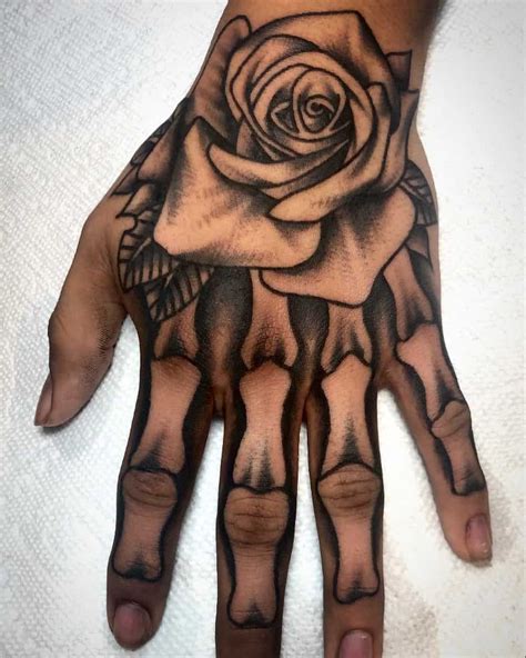 60 Skeleton Hand Tattoo Ideas And The Symbolism Behind Them Skull Hand Tattoo Skeleton
