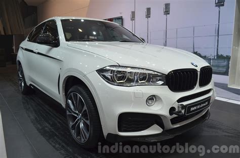 These exterior mirror caps made of. BMW X6 with M Performance Parts front three quarters at IAA 2015