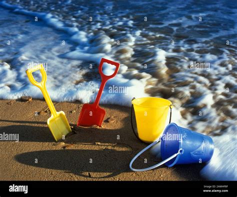 Childrens Beach Spades And Buckets Beside The Sea Stock Photo Alamy