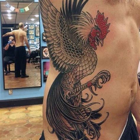 awesome very detailed colorful big cock tattoo on side tattooimages