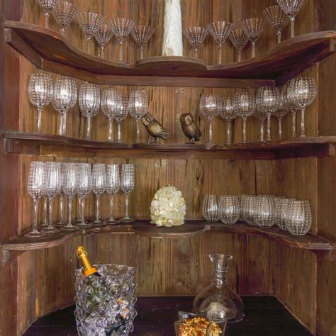Rustic Wood Wine Bar With Clear Goblets And Tumblers On Shelves Hgtv