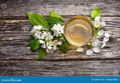 Jasmine Flowers And Cup Of Healthy Tea Herbal Medicine A Cup O Stock
