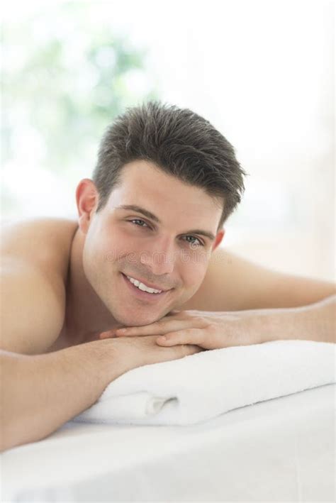 Relaxed Man Lying On Massage Table At Spa Stock Image Image Of Enjoyment People 32429871