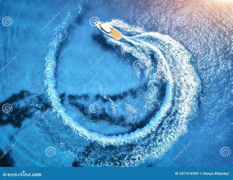 Aerial View Of The Speed Boat In Clear Blue Water At Sunset Stock Image
