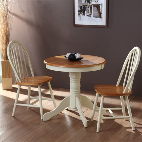 Anji kitchen table and 4 metal chairs reflect this style: Beautiful White Round Kitchen Table and Chairs - HomesFeed
