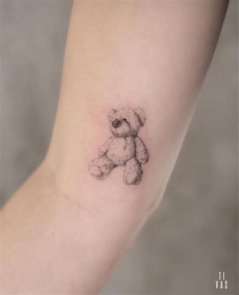 A Small Teddy Bear Tattoo On The Arm