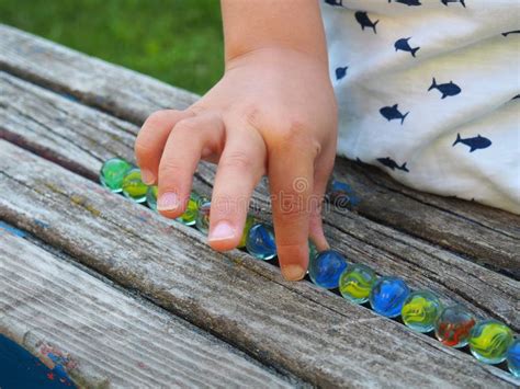 227 Child Playing Marbles Stock Photos Free And Royalty Free Stock