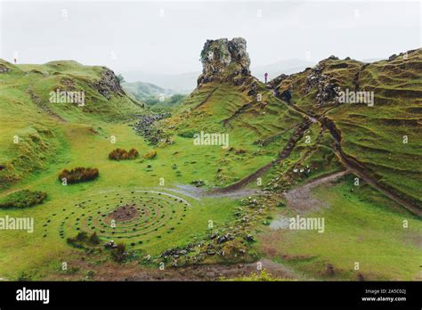 Circles Of Stones And Pathways Twist Through The Enchanting Grass